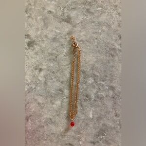 Elegant Gold Chain Bracelet with red bead